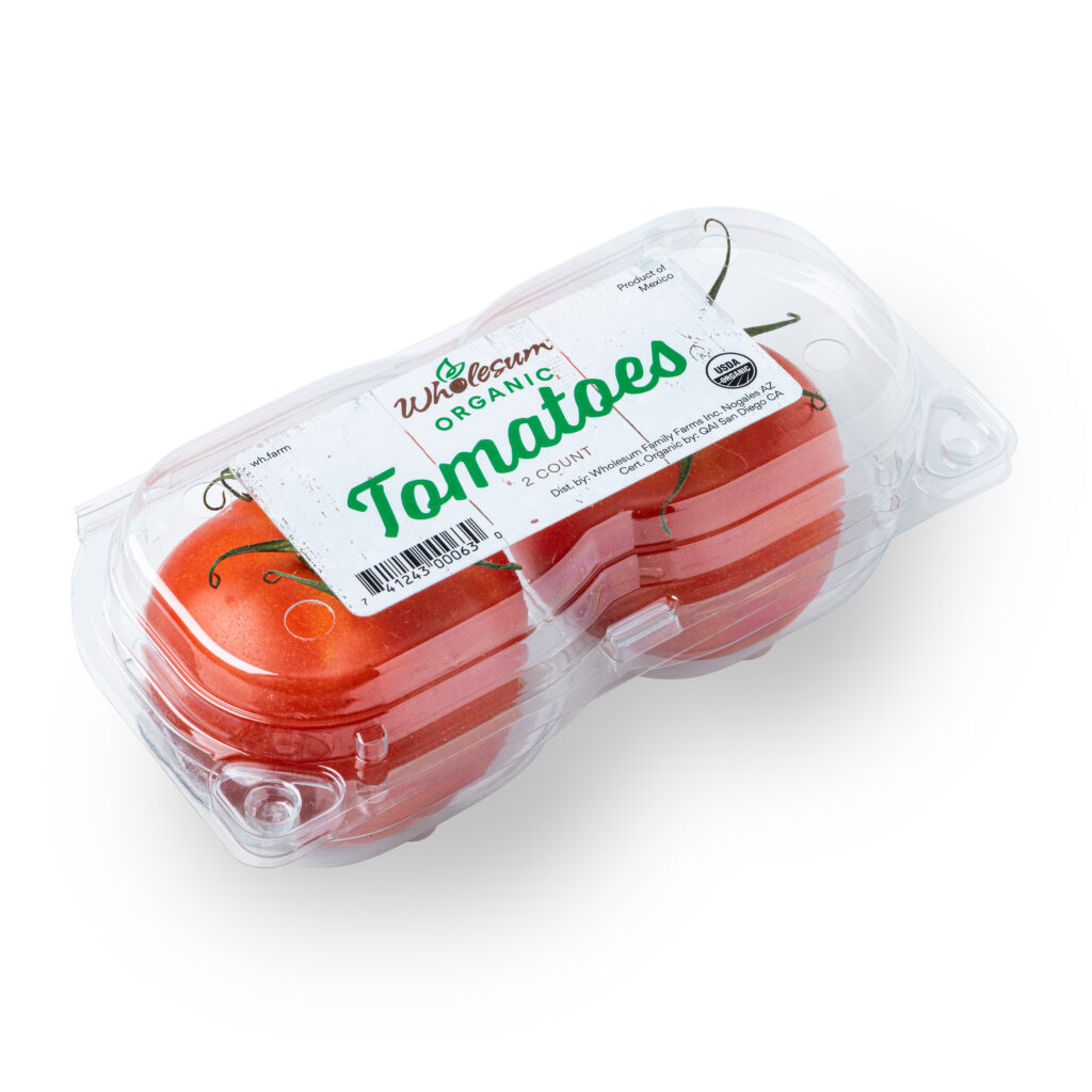 Two beefsteak tomatoes in a clamshell