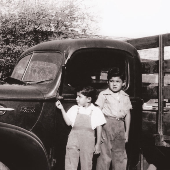 old photo of kids in front of truck