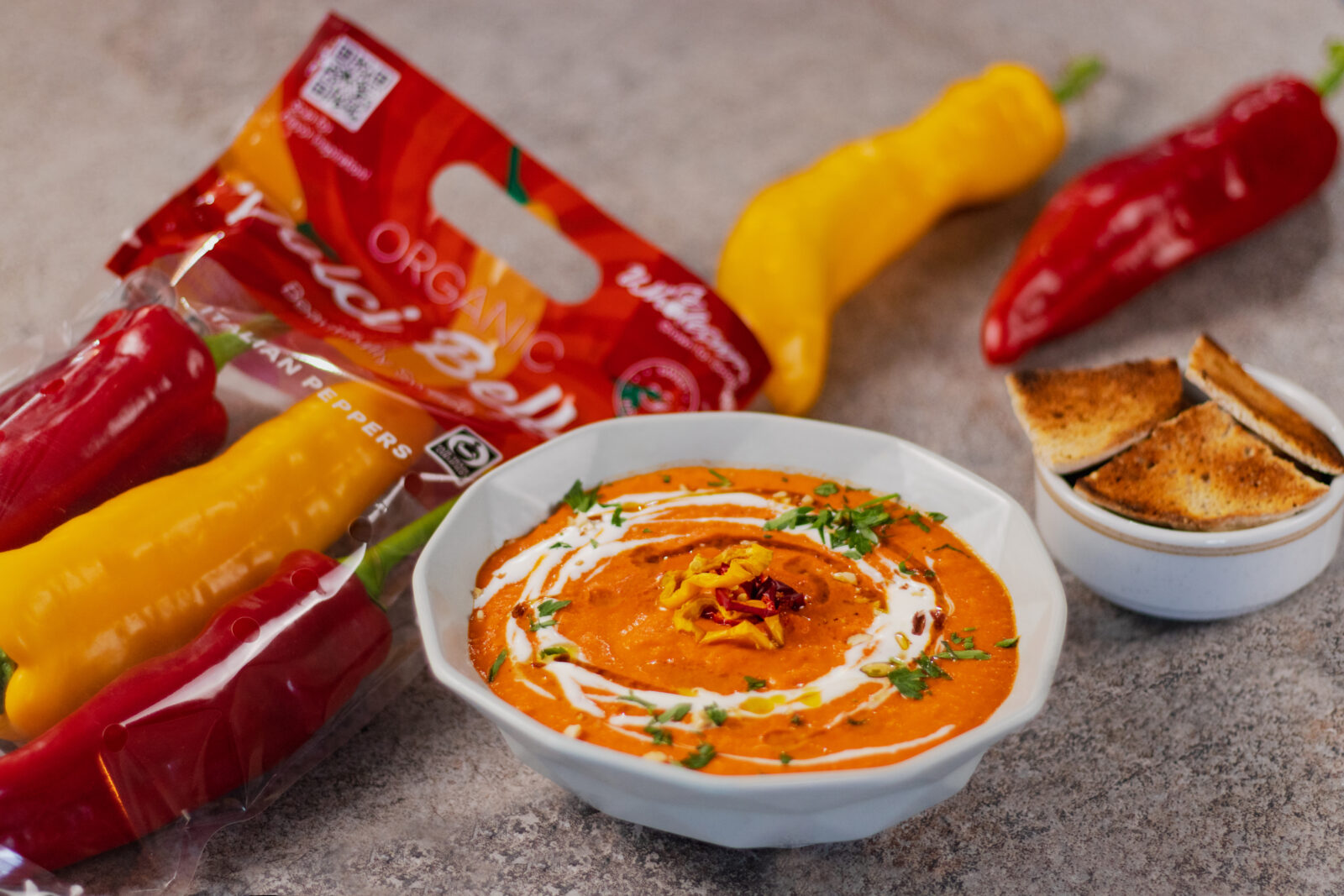 bowl of roasted Italian pepper soup with bread