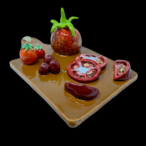 ceramic cutting board with tomatoes