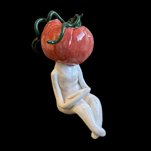 sculpture of woman with tomato head